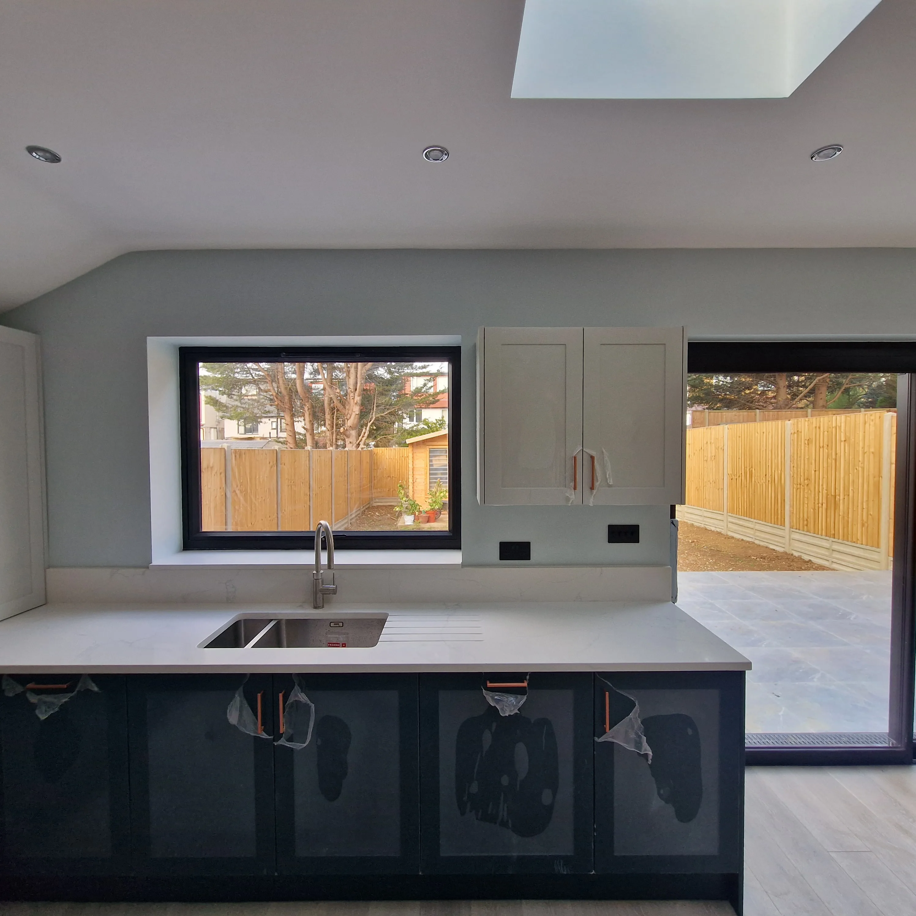 London Building Services craftsmen reviewing renovation plans