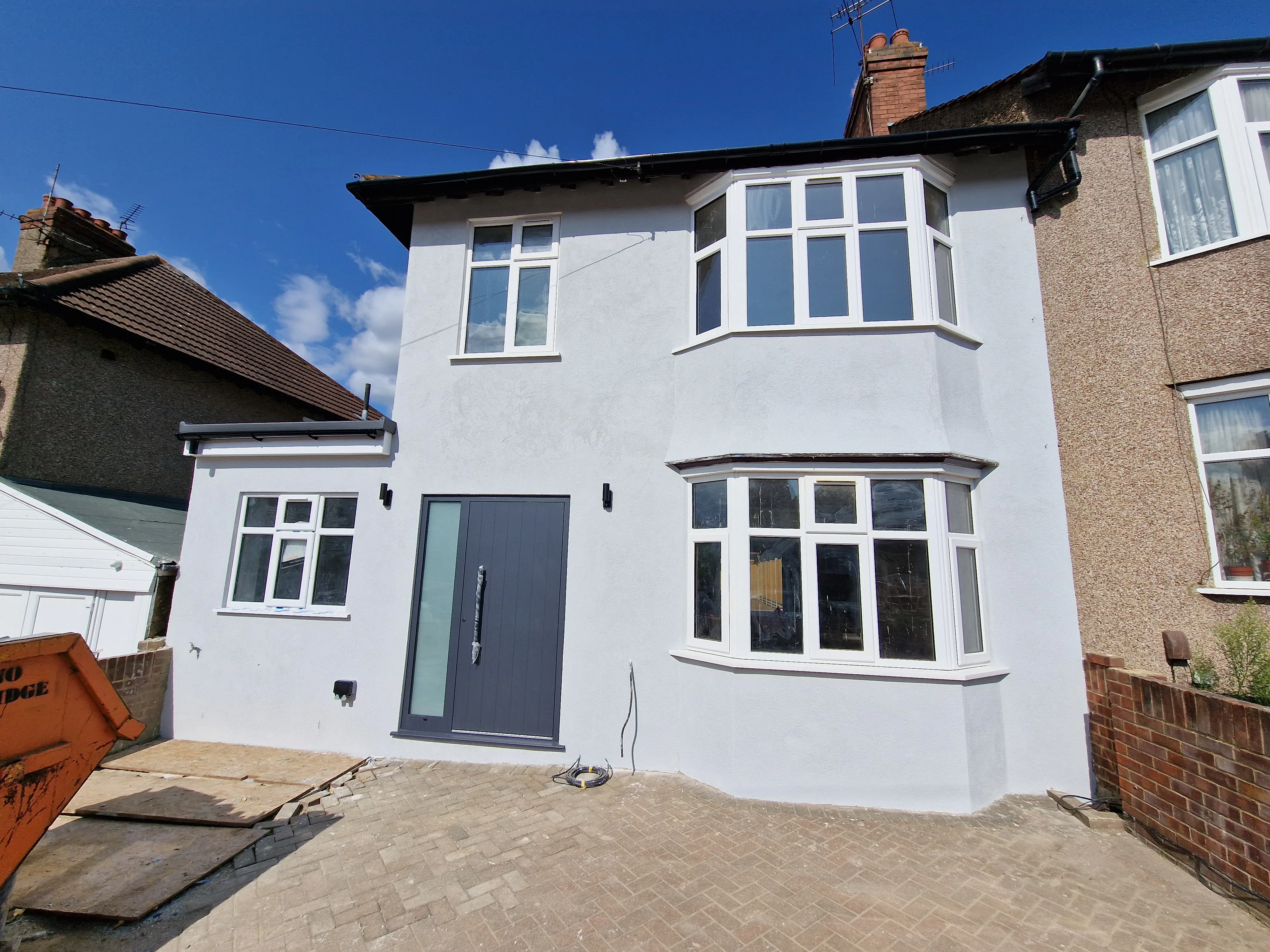Newly renovated house exterior with modern façade and fresh render