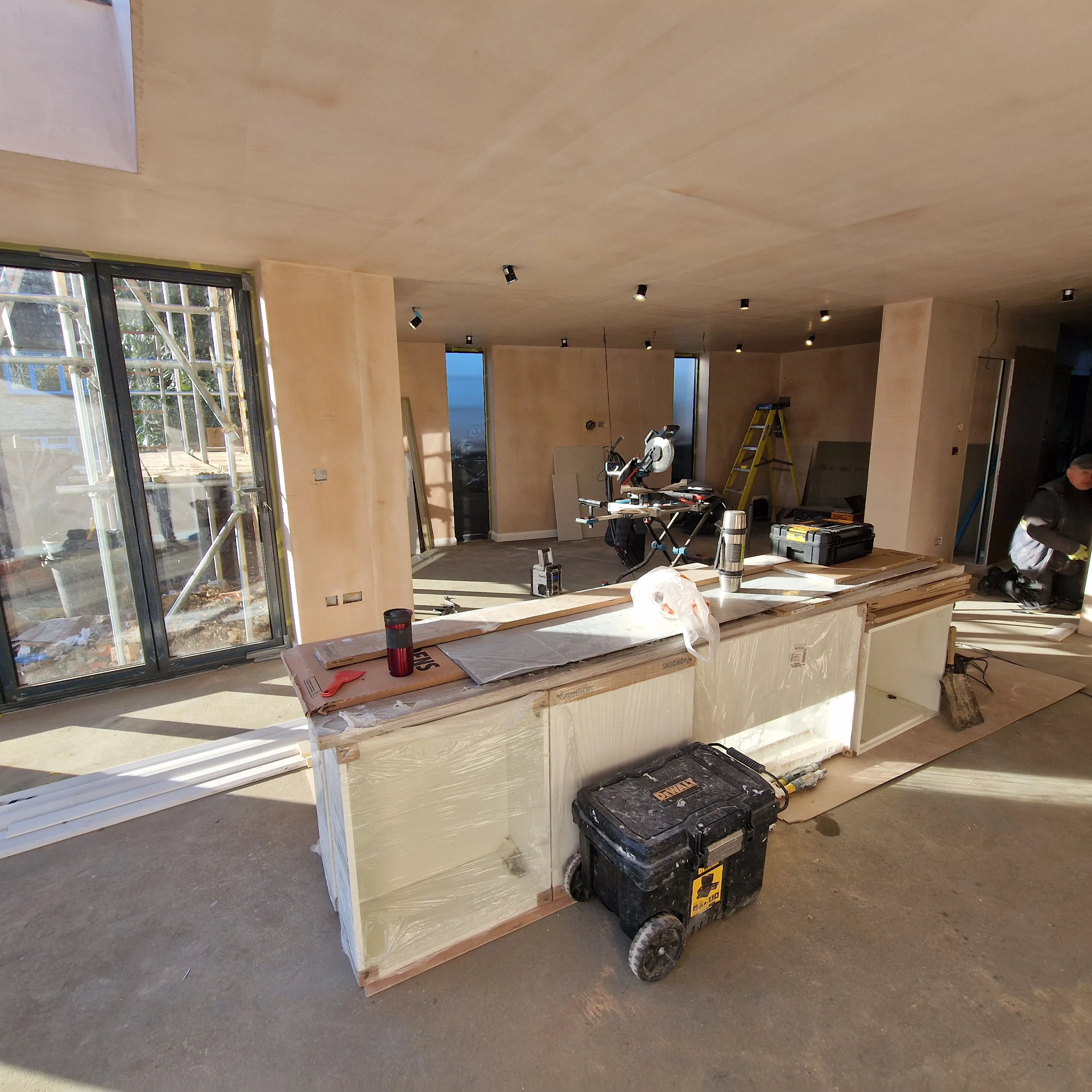 Kitchen refurbishment in progress showcasing modern design and ongoing installation work