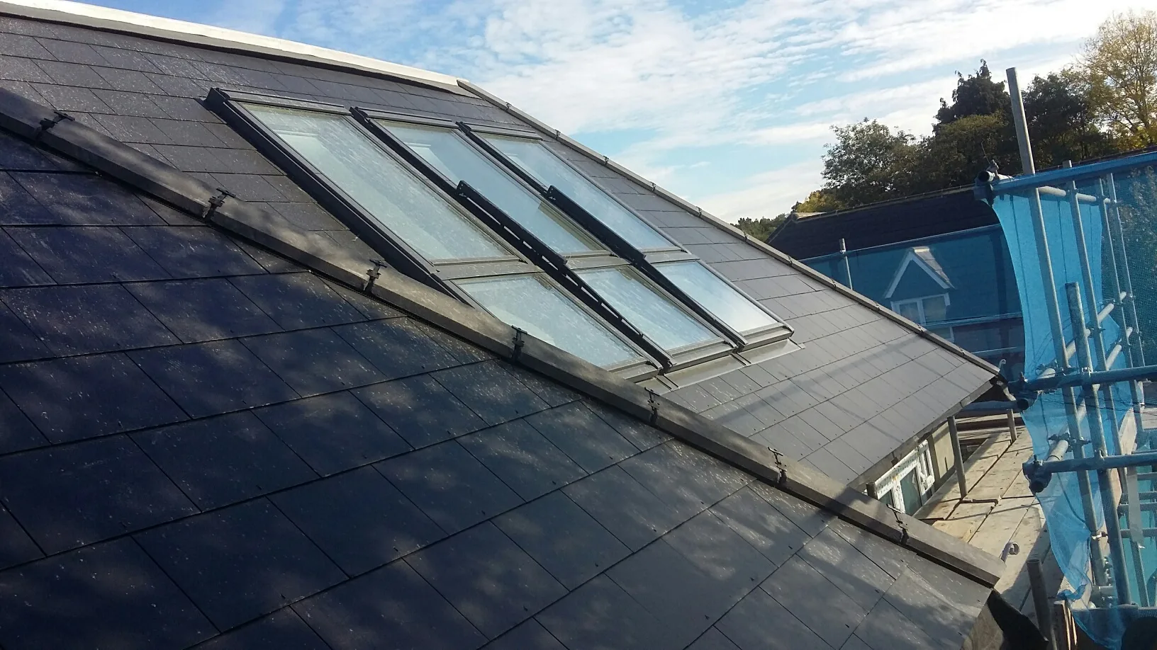 Roof with multiple skylights under construction, showcasing quality materials and attention to detail