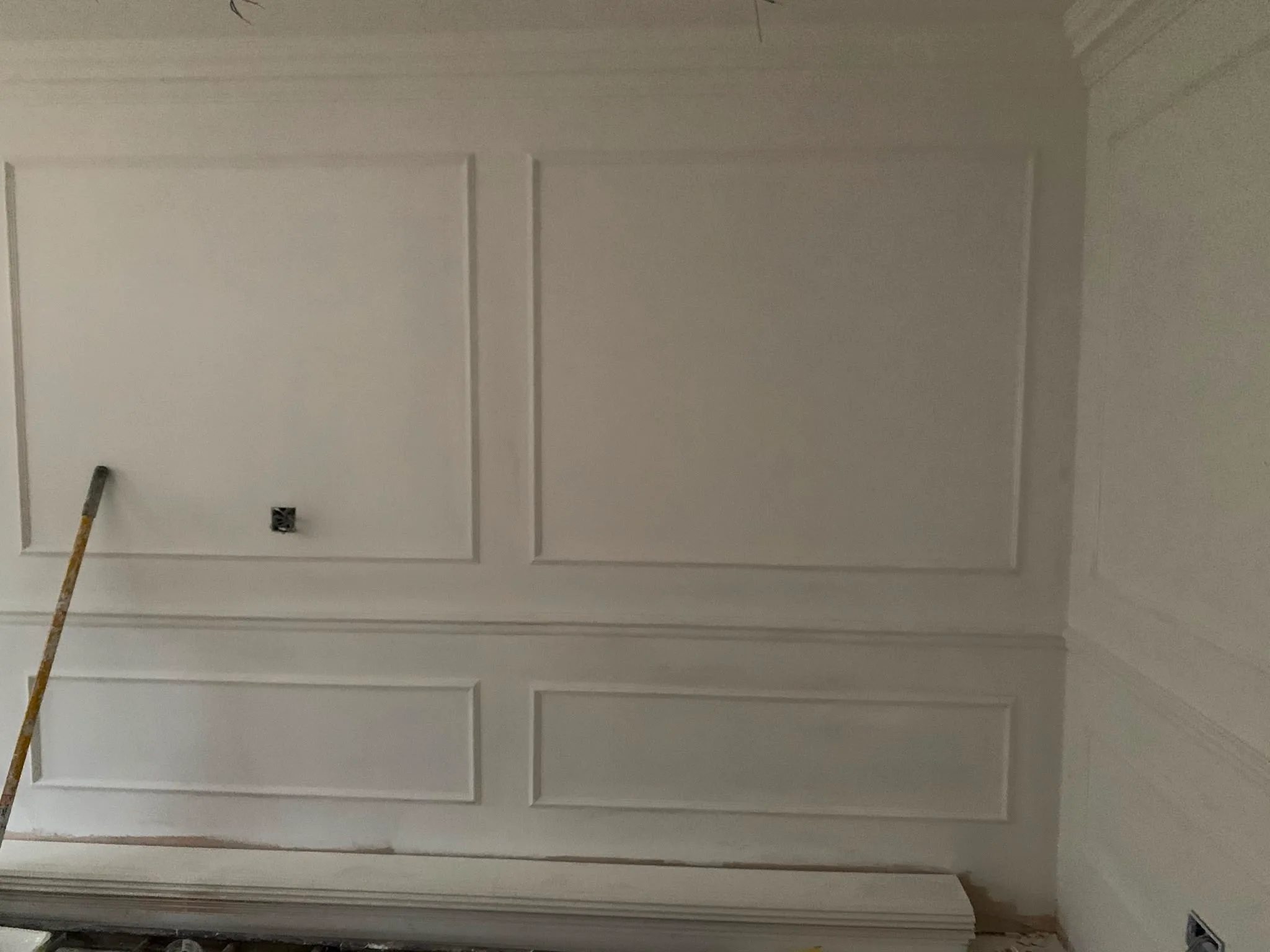 A well-finished interior wall with decorative paneling in a renovation project
